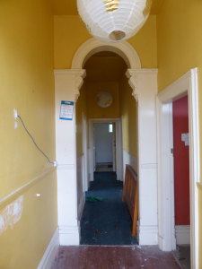  Looking down the hallway from just inside the front door, with the door to the master bedroom at right. Image: L. Tremlett.