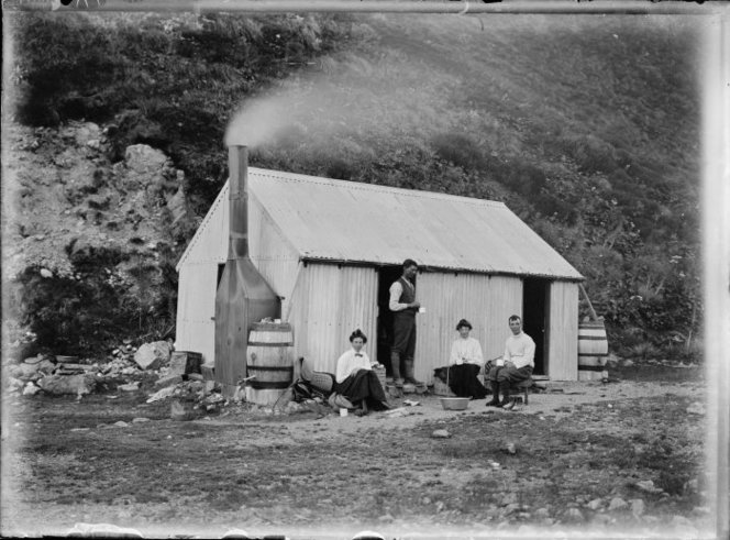 Ball hut, 1907. Earlier photographs indicate that it was built without a fireplace, or the capacity to capture rainwater. The archaeological remains indicate that the hut expanded a lot before being destroyed by an avalanche in 1925. Image: Gifford, Algernon Charles, 1862-1948. Gifford tramping party at Ball Hut, Mt Cook. Gifford, Algernon Charles, 1862-1948 : Albums and photographs. Ref: 1/2-060503-G. Alexander Turnbull Library, Wellington, New Zealand. http://natlib.govt.nz/records/22583972